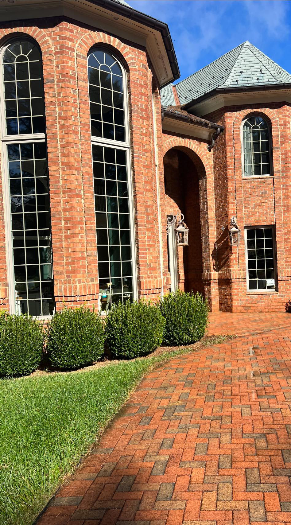 Brick after cleaning with dark spots, dirt, and grime removed.